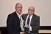 Dr. Nagib Callaos, General Chair, giving Eng. Joseph Prezzama an award "In Appreciation for Delivering a Great Keynote Address at a Plenary Session."